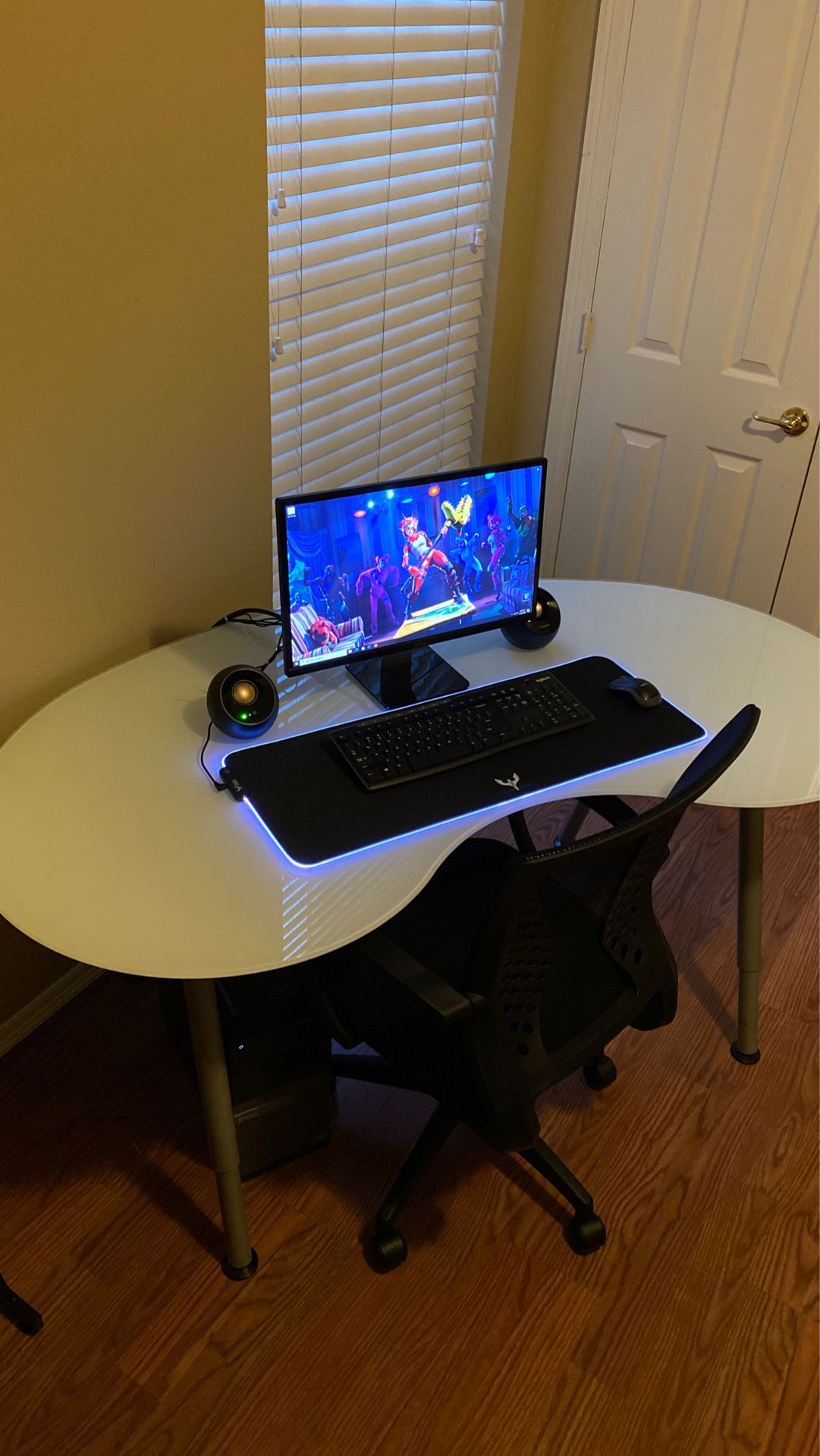 Dell computer, monitor, glass desk, chair, speakers, keyboard and mouse with LED light pad