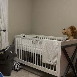 3-in-1 Convertible Crib with the mattress and toddler guardrail.