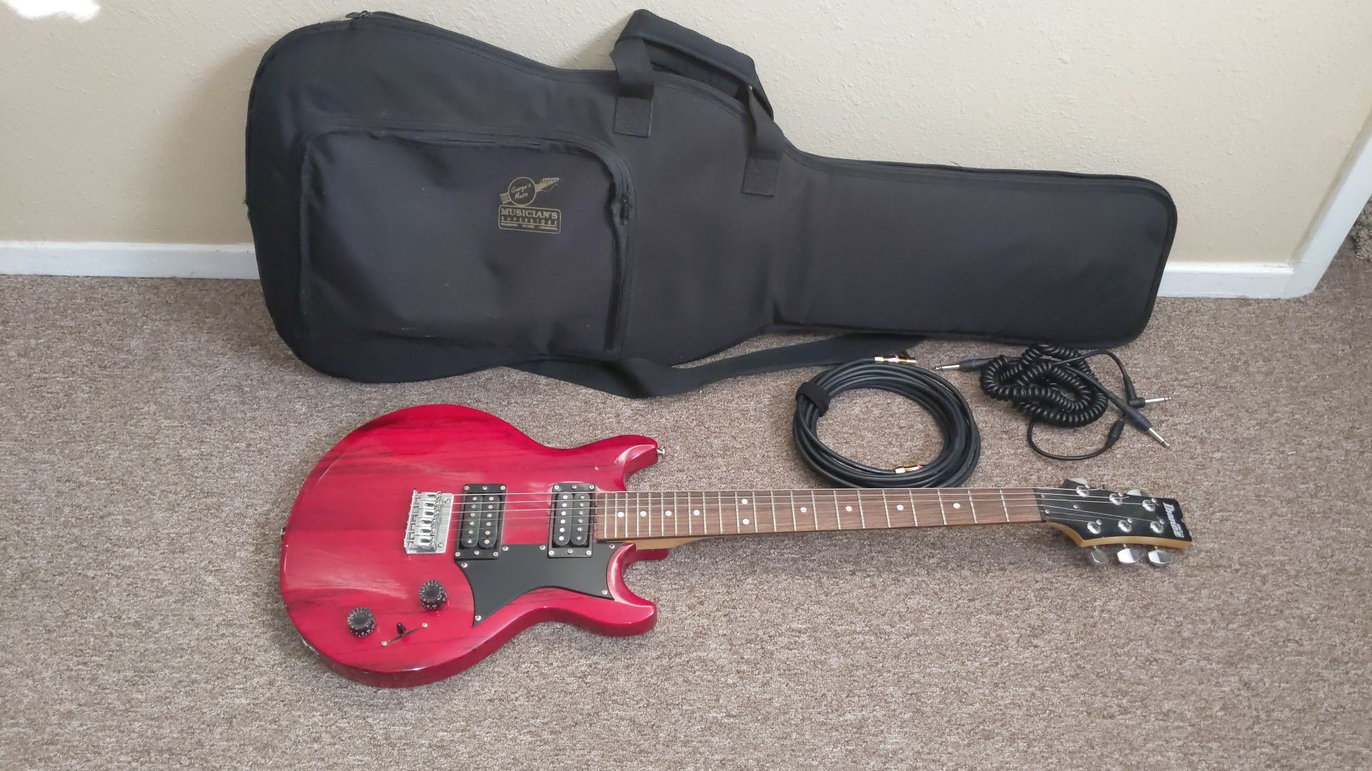 Ibanez electric guitar with padded gig bag and extras