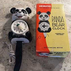 Antique animated panda bear clock