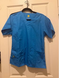 Brand new never worn. Small woman blue scrubs by Wonder Wink