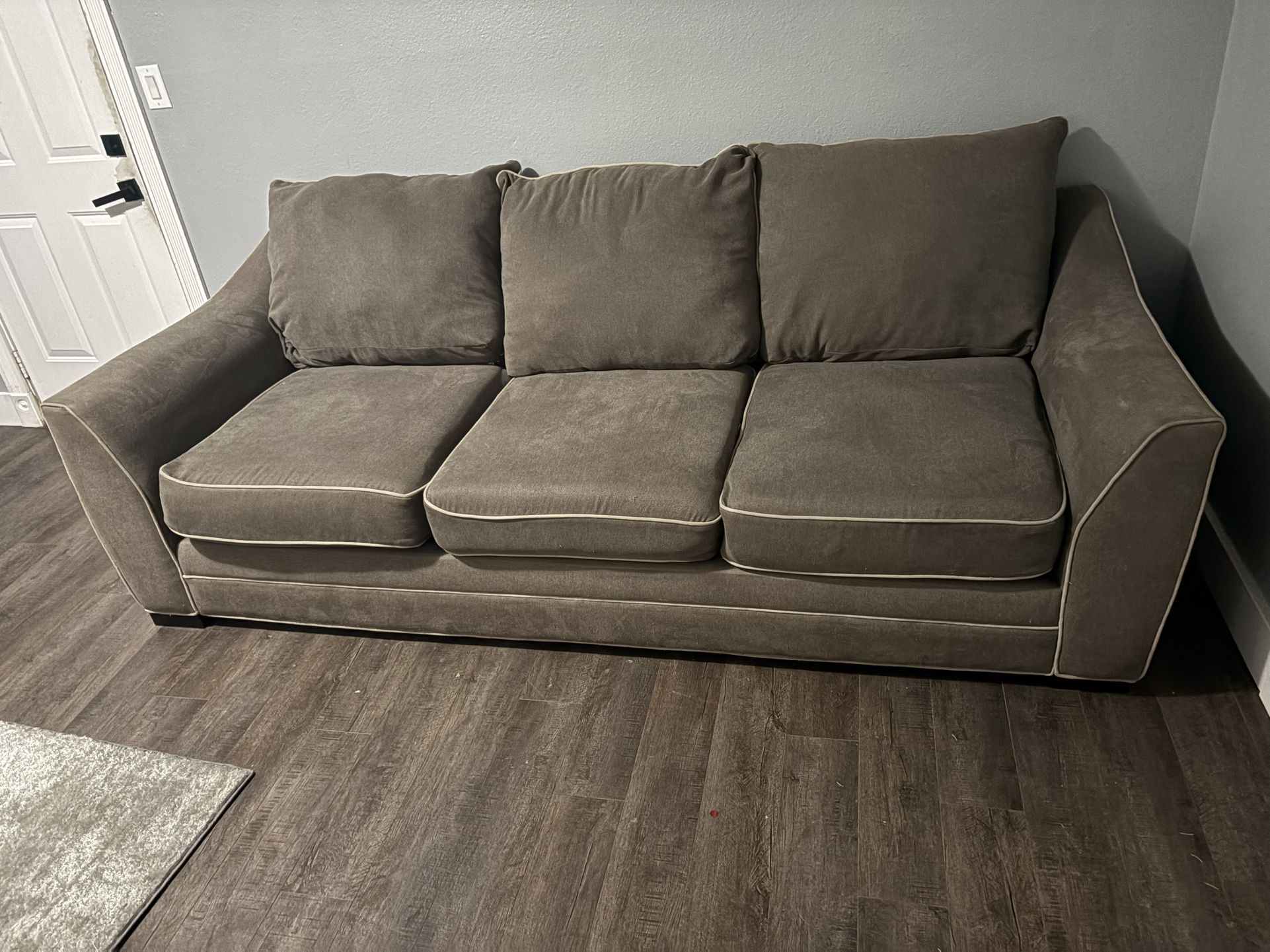 Brown 3 cushion sofa