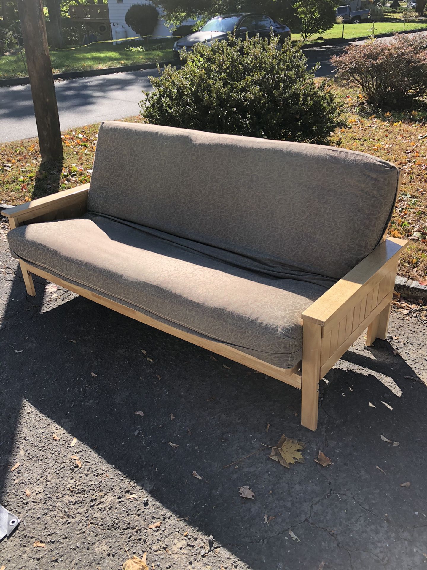 Futon with pull out side tables