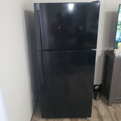 Whirlpool Refrigerator . Needs Freon . Sold As Is!!!