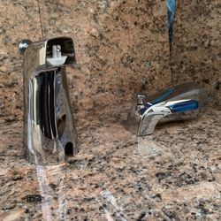 New, chrome tub spouts with pull on diverter and 1/2” pipe connection