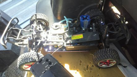 A gas RC car for parts or fix up I've got the controller it's got the pull rope it's got the gas tank I just don't have the plastic cover as is