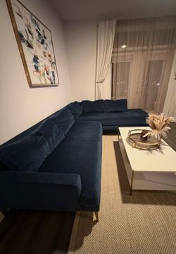 West Elm L shaped blue couch