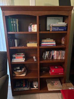 LARGE WOOD BOOKCASE WITH ARCHED DETAIL