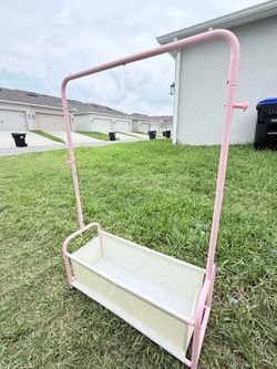 Selling pink clothing rack with storage box 48x34x12.