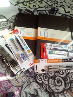 Mole skin ruled notebook,0.7 zebra pens,0.7 pentel mech pencil