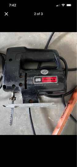 Electric jigsaw hatchet, machete, battery charger various grilling utensils all working order the grilling utensils somewhere new