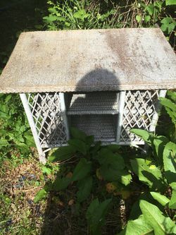 Outdoor wicker table, good condition, but can use some paint