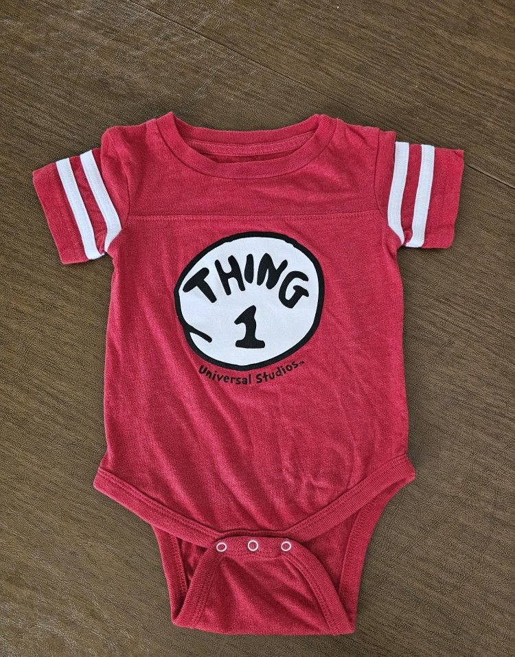 Dress up your little one in this adorable Dr. Seuss Thing 1 one-piece in vibrant red. Perfect for both baby boys and girls aged 12 months, this outfit