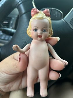This is a vintage bisque porcelain Kewpie doll