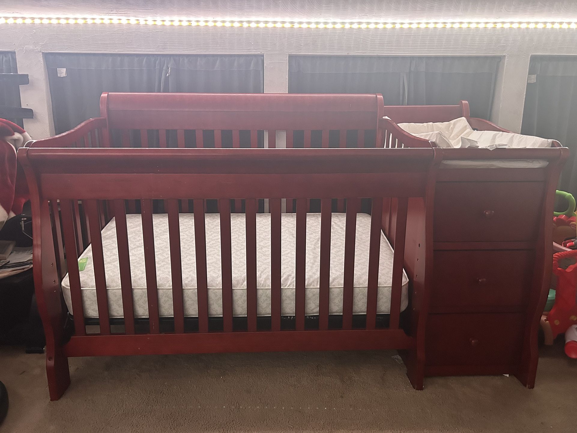 Wooden Crib With Attaches Drawers And Shelves