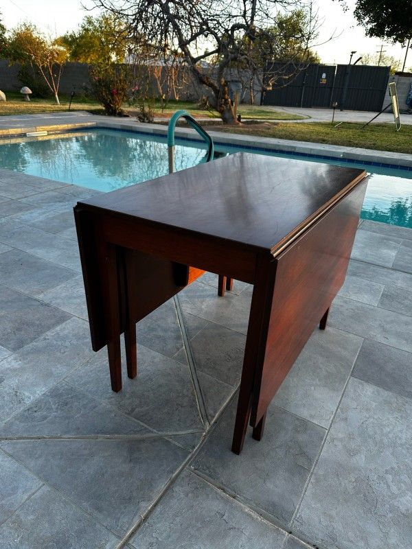 Suter's Antique Reproduced Cherry Drop Leaf Table