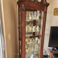 Display cabinet with glass door. 5 Tier Curio cabinet with light. $400 including figurines. Excellent Condition