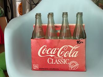 Collectible coke bottles and carrier. Perfect.