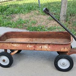 Vintage metal Ace wagon and old milk can
