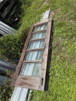 Vintage double  door glass connected together with brass hinges