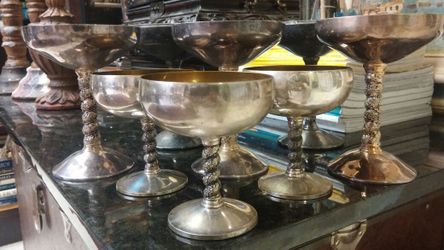 Set of wine & champagne silver goblets.