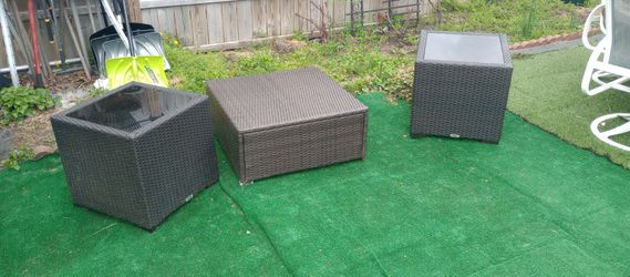Wicker side tables and foot stool or table.have foot rest cushion. Great condition.made by Prestige