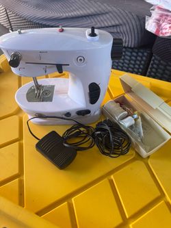 Loops and threads sewing machine