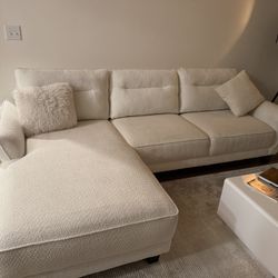 White Couch, Center Table, And Entertainment Center