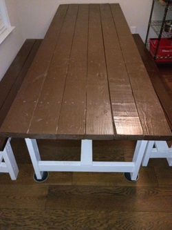 Handmade wooden farmhouse dining table with two benches