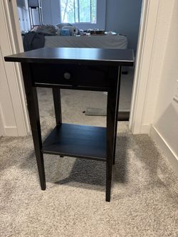 Black wooden nightstand