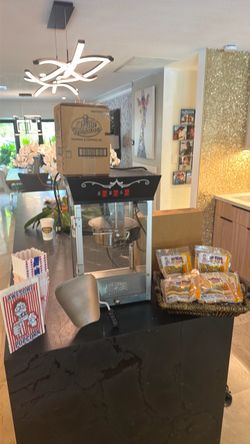 Movie theater popcorn machine plus year worth of popcorn butter and oil