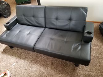 Leather couch/ futon type bed