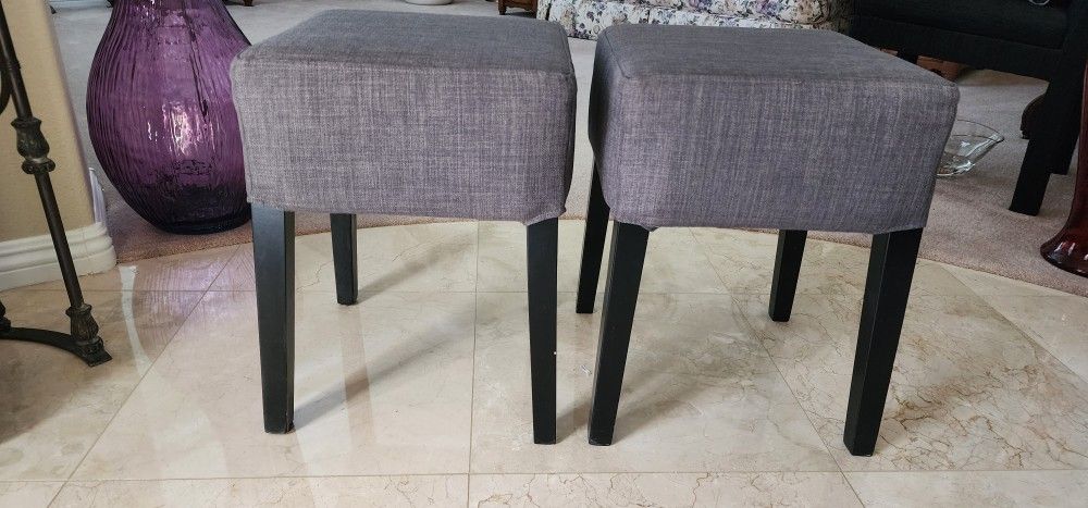 2 New Matching Ottomans/Stools. 14" x 14" x 19" tall. Very sturdy with thick / comfortable cushions.
Durable gray fabric.