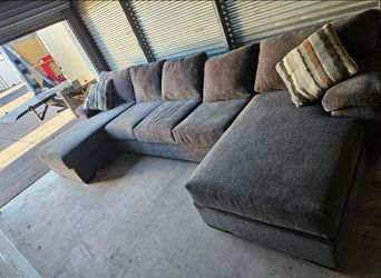 Sectional dark gray sectional couch located in Mesa crossroads Main Street and Gilbert rd
