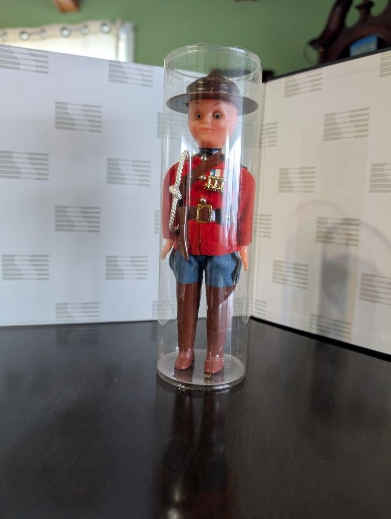  vintage celluloid Canadian Mountie doll.