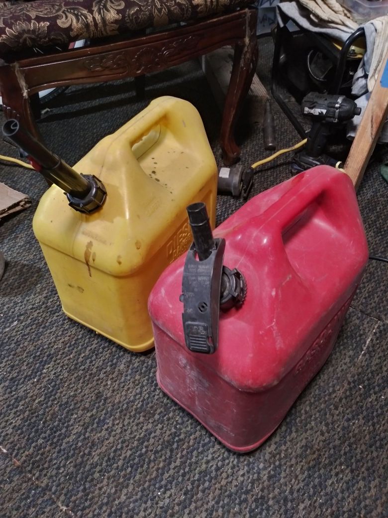 TWO NON SPILL 5 GAL GAS/AND DIESEL IN GREAT CONDITION 15EACH OR BOTH FOR 25$