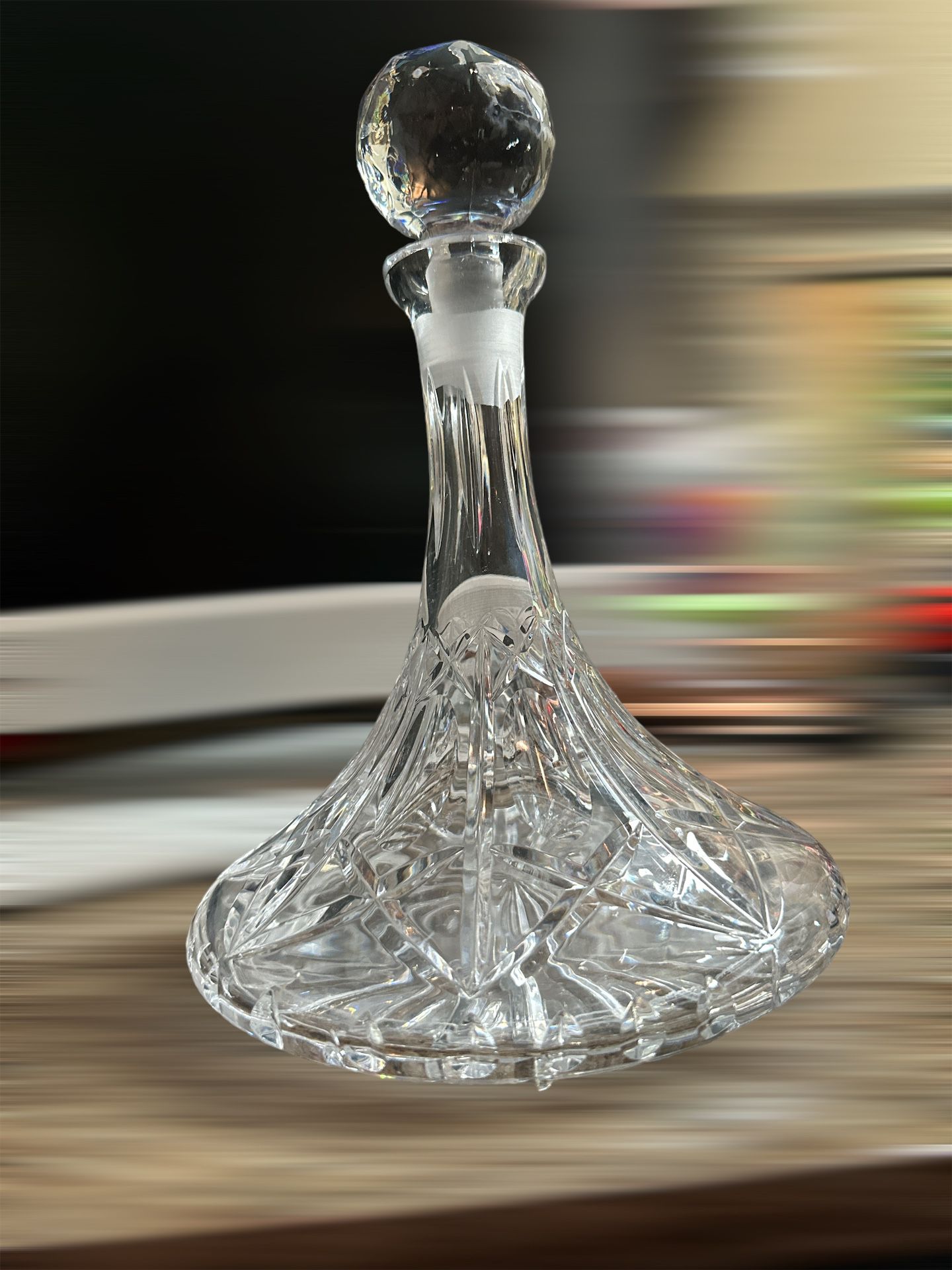 This crystal decanter is absolutely stunning!    Hand Cut Art Glass in a vertical line   crisscross diamond/fan pattern.    Its deep cuts are brillian