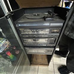 Music system with record player and extra storage