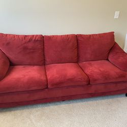 Red couch, chase and pillows in excellent condition
