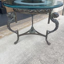 Claw feet accent glass table with Lion Heads 1800s-early 1900s- very heavy side table -22” tall x 28” wide- top was replaced with a very heavy glass i
