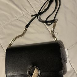 New versus cross body purse