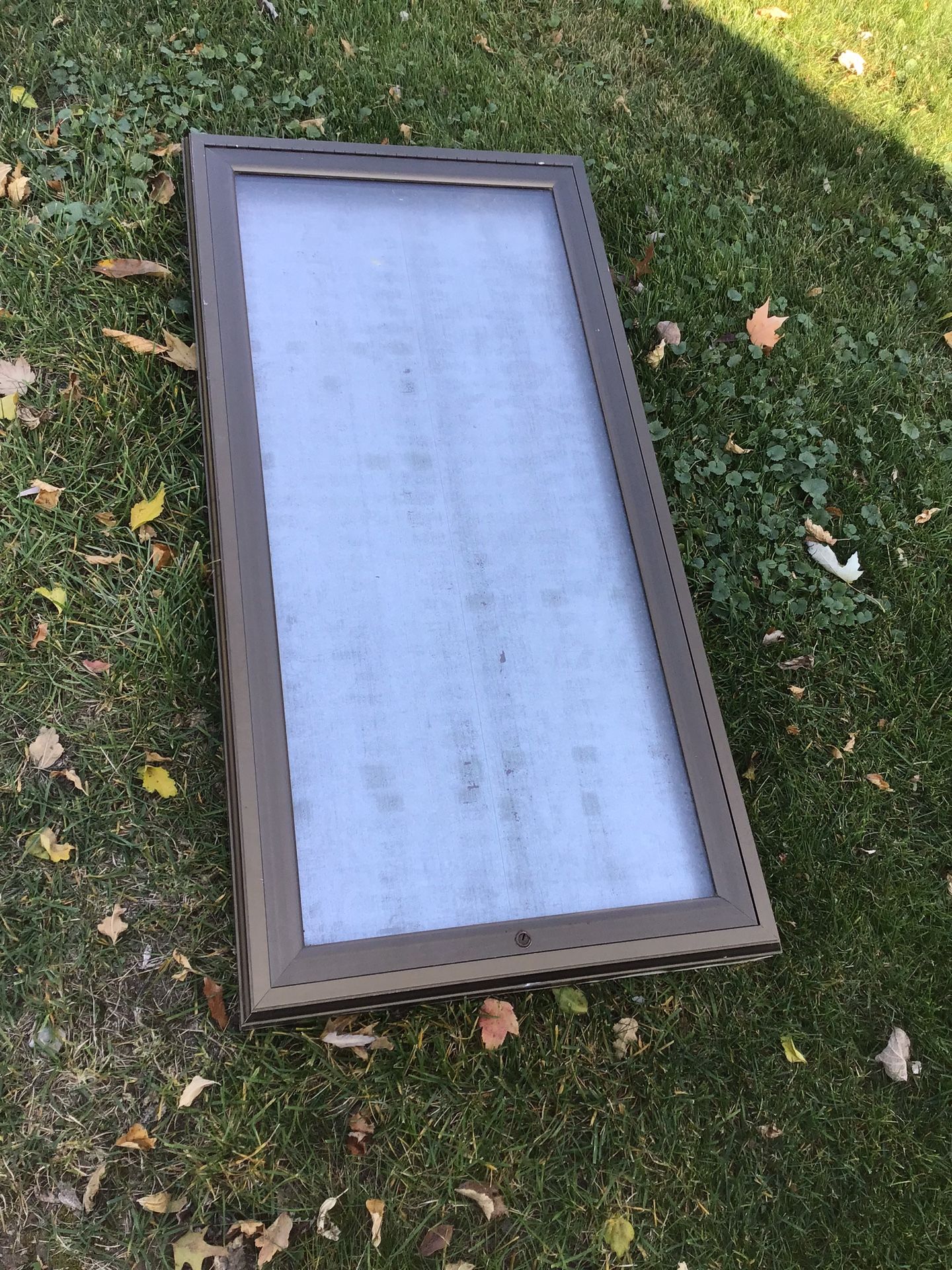 Display case. Metal with a glass top that opens.