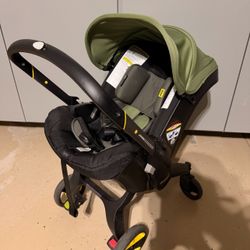 Doona with car base:  Baby Stroller used 2 Months 