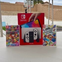 Nintendo Switch Oled with super Mario party and Mario kart deluxe 8 with 2yr Warranty 