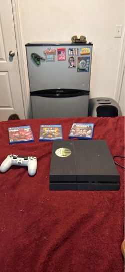 PS4 with controller and games