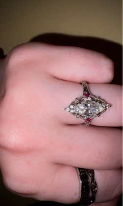 10k White gold marquis engagement ring with ruby side stones