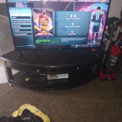 TV Stand. Used But Still Good. Has Some Scratches