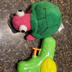 Paris Presents magenta/green turtle window toy and mini squirt gun 