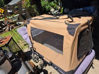 Fold away pet carrier for dogs or cats with removable pad. Pockets on the back. Easy carry straps.