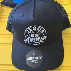 New black Decky trucker hat with a mesh back and a snapback closure. This hat is made of cotton and polyester and has a graphic print on the front pan